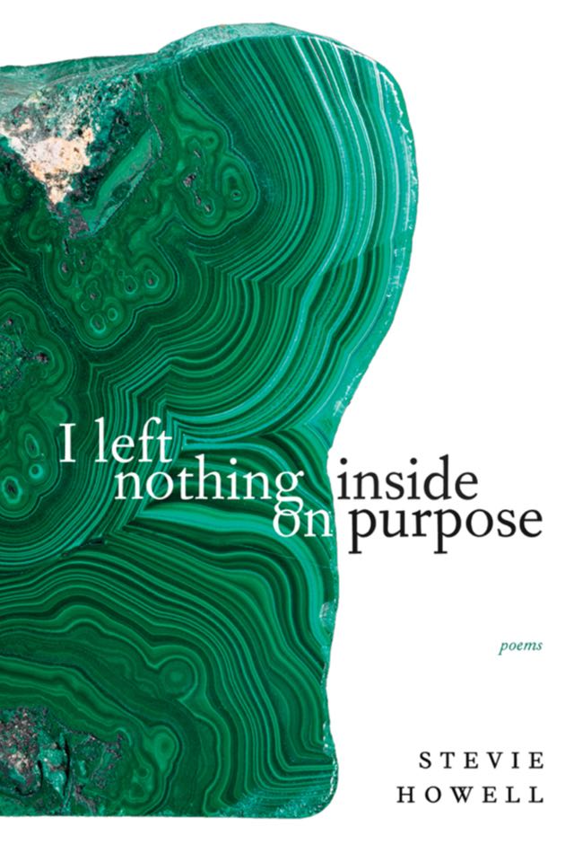 Cover features a large chunk of green malachite.